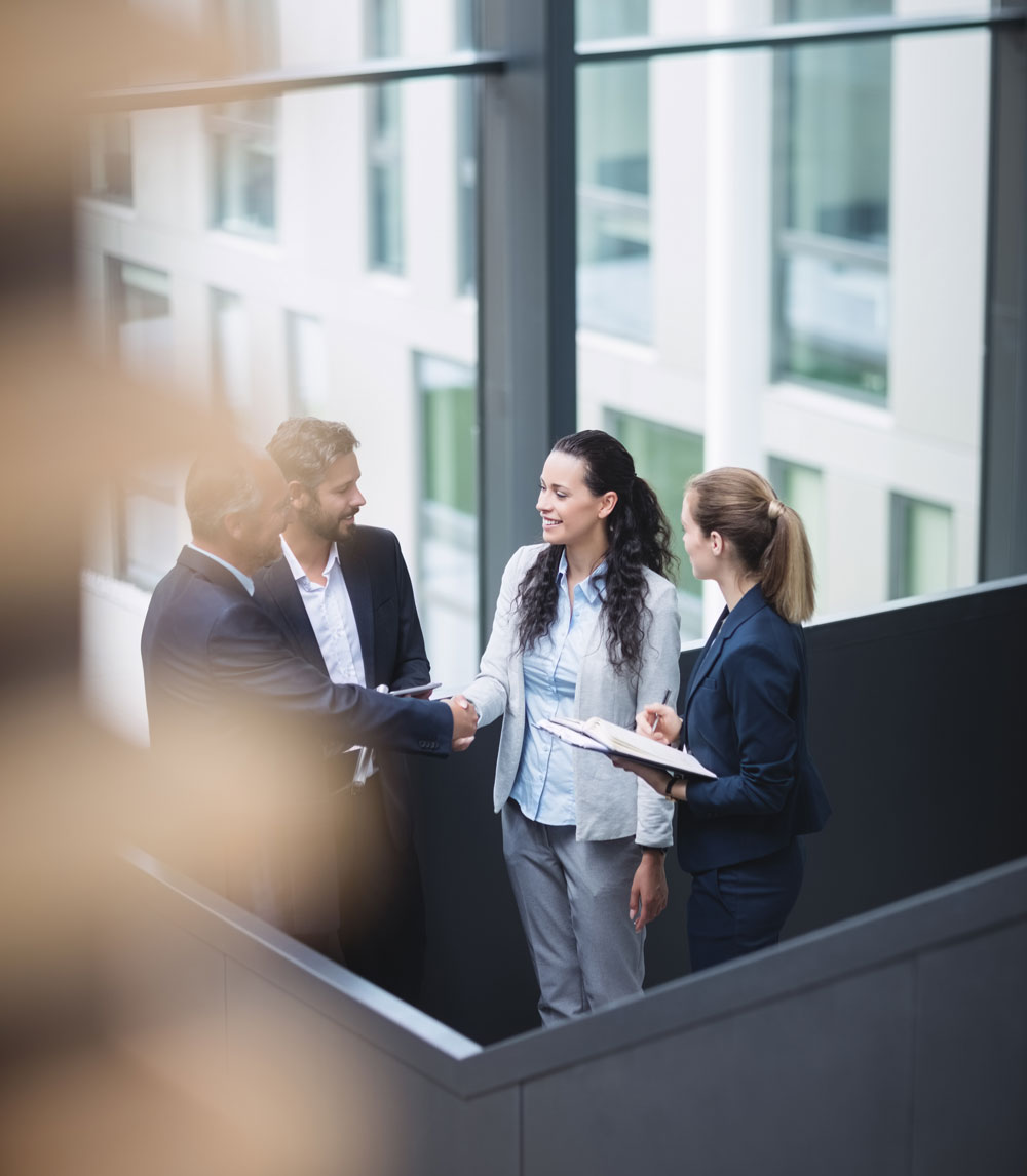 businesspeople-having-discussion-office