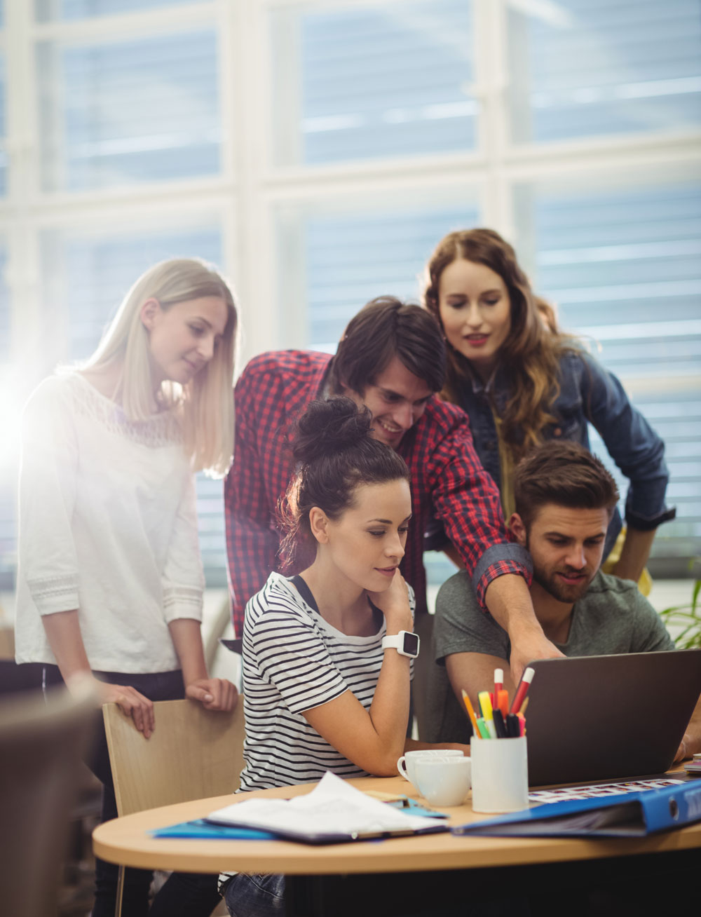 group-business-executives-discussing-laptop-their-des